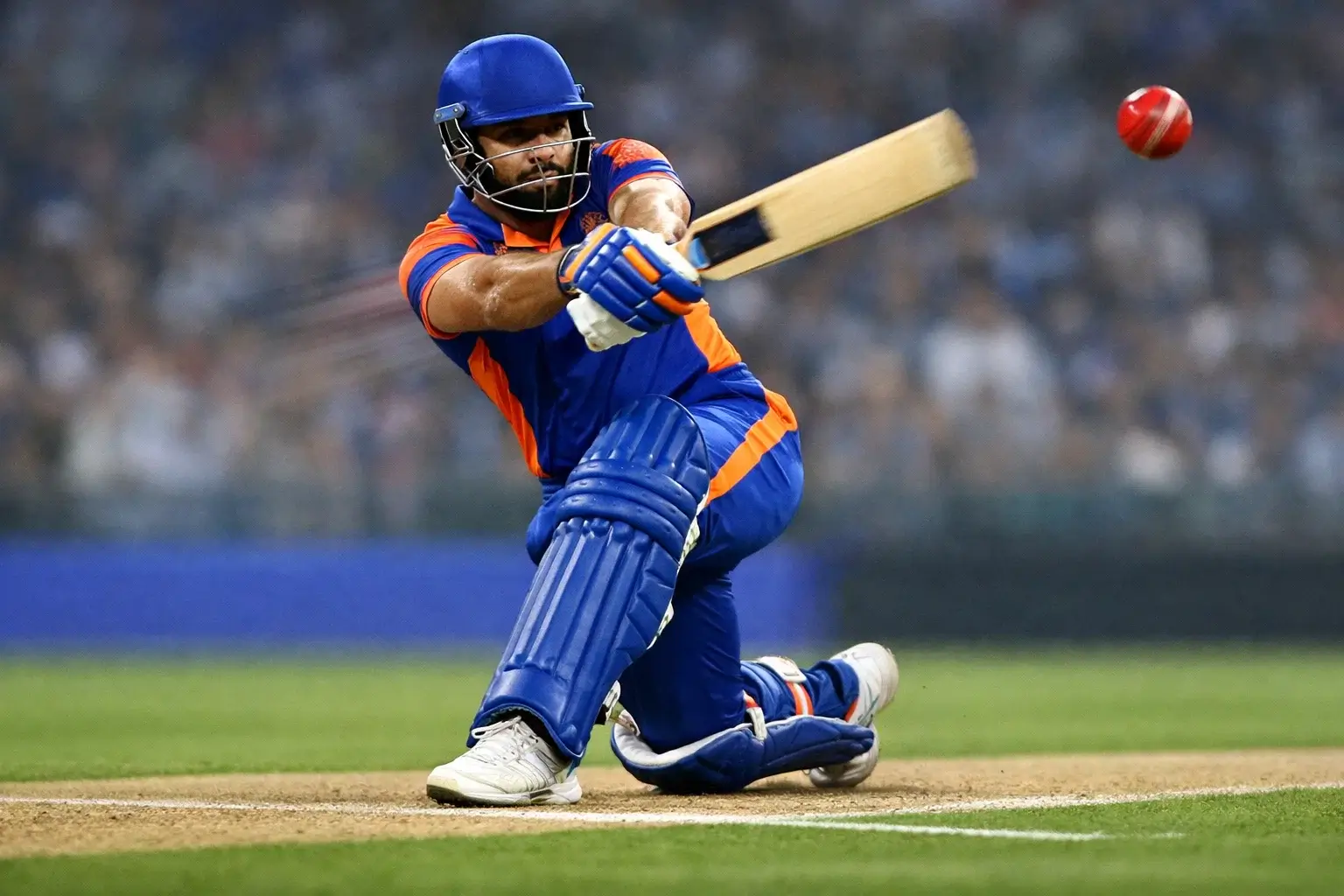 Cricket batsman playing an aggressive shot during T20 match